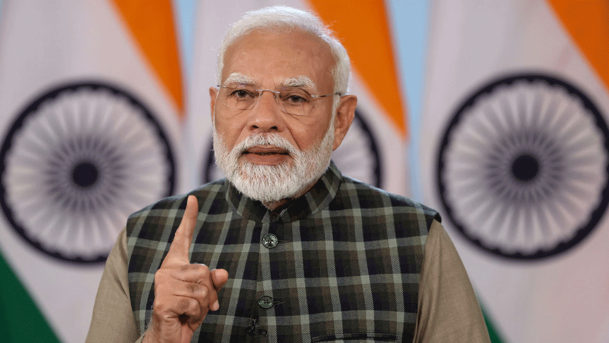 Portrait of Narendra Modi, Prime Minister of India, delivering a speech.