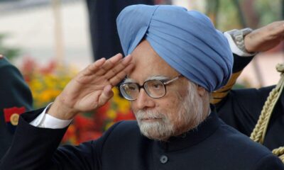 "Funeral procession of Manmohan Singh at Nigambodh Ghat in Delhi with mourners paying tribute.